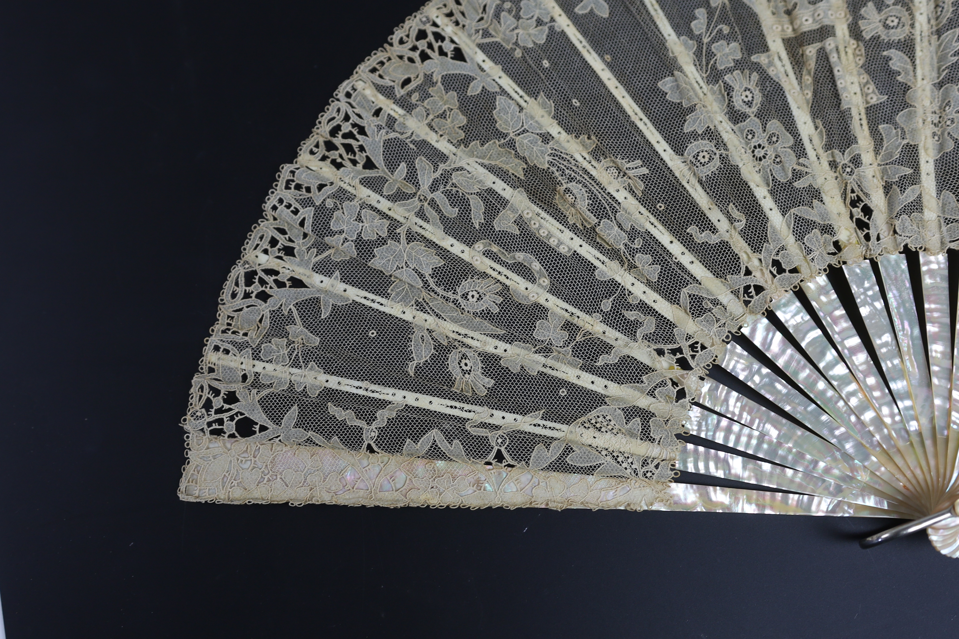 An unusual commemorative Carrickmacross lace fan, possibly one made and entered for a group of competitions held by the Worshipful Company of Fan Makers, the winning fan to be presented to Queen Victoria as a gift for he